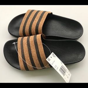 Adidas Adilette cork slides sandals.